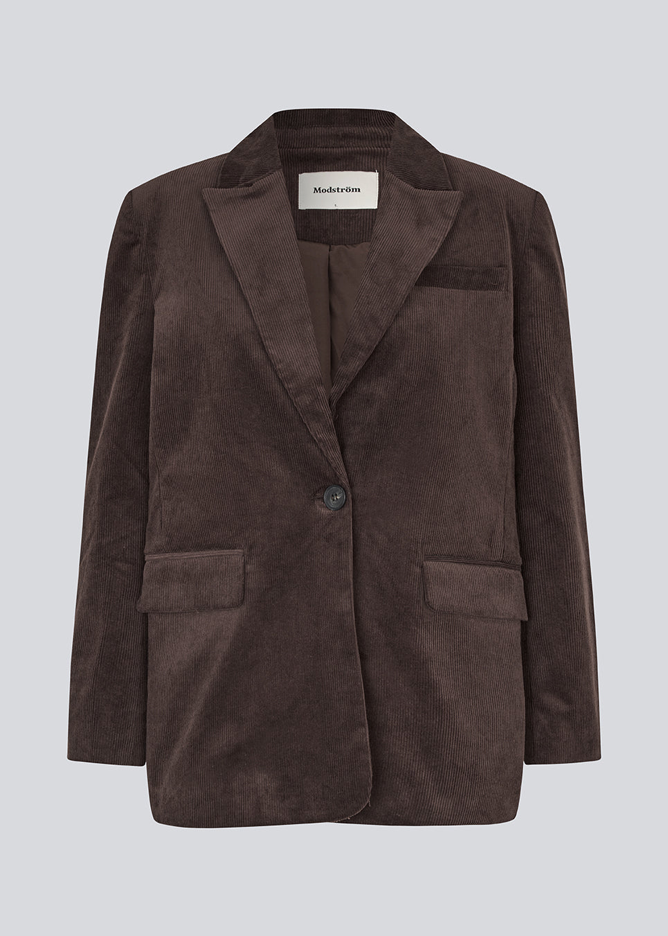 Blazer med klassisk og elegant design i fløjl. Pablomd blazer har knappelukning og to lommer fortil. Modellen er 175 cm og har en str. s/36 på.