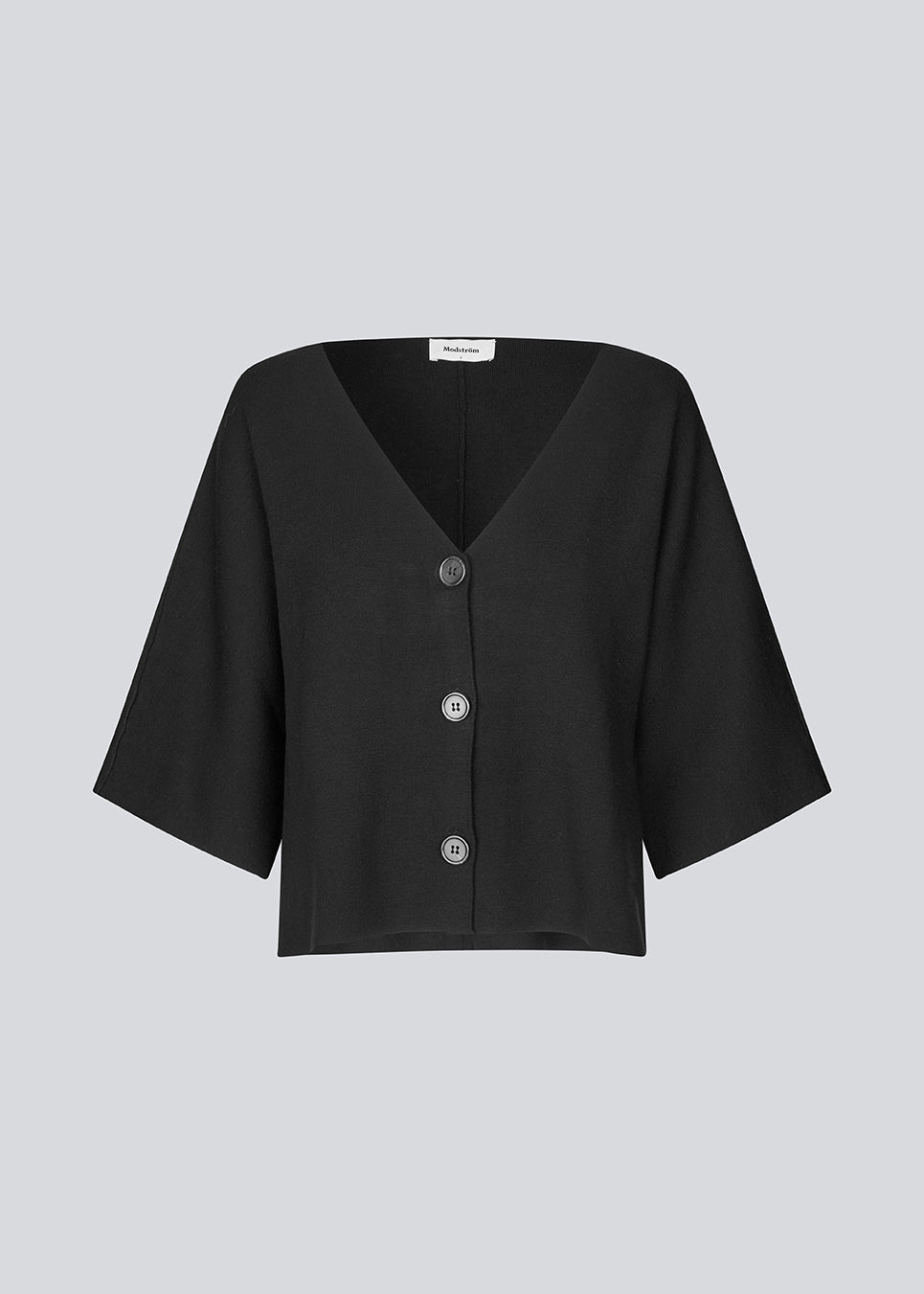 Strikket cardigan i sort med korte ærmer i EcoVero viscose. Parismd SS cardigan har en v-udskæring og knappelukning fortil.&nbsp;