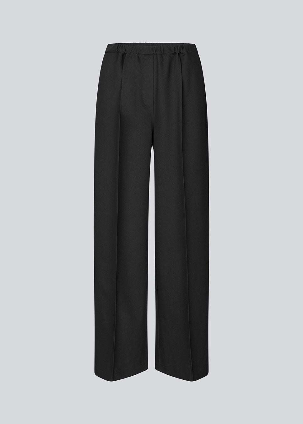 Sorte bukser med brede ben og pressefold. Ridermd pants har sidelommer og elastisk talje – stilrene og komfortable på én gang.