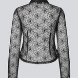 Sort figursyet skjorte i gennemsigtig materiale. Roccomd shirt har en klassisk krave og knaplukning med et smuk syet rosenmønster – feminin og stilfuld.
