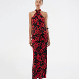 Lang nederdel i et smukt rosenprint. Ruthiemd skirt har elastik i taljen og er lavet i genanvendt polyester– &nbsp;en klassisk og elegant style.