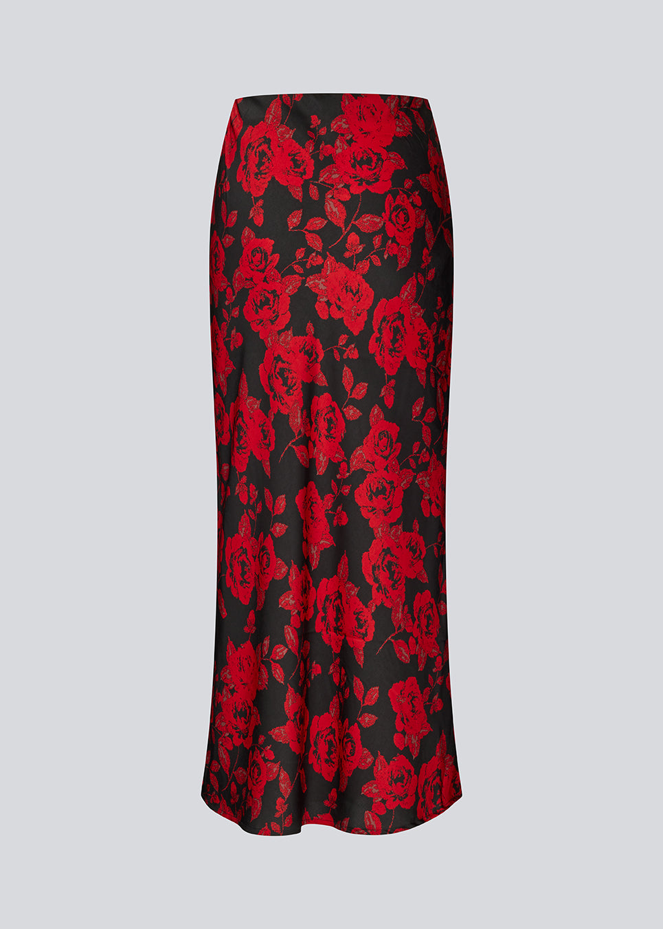 Lang nederdel i et smukt rosenprint. Ruthiemd skirt har elastik i taljen og er lavet i genanvendt polyester– &nbsp;en klassisk og elegant style.