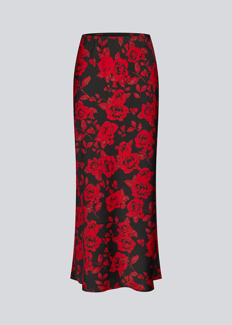 Lang nederdel i et smukt rosenprint. Ruthiemd skirt har elastik i taljen og er lavet i genanvendt polyester– &nbsp;en klassisk og elegant style.