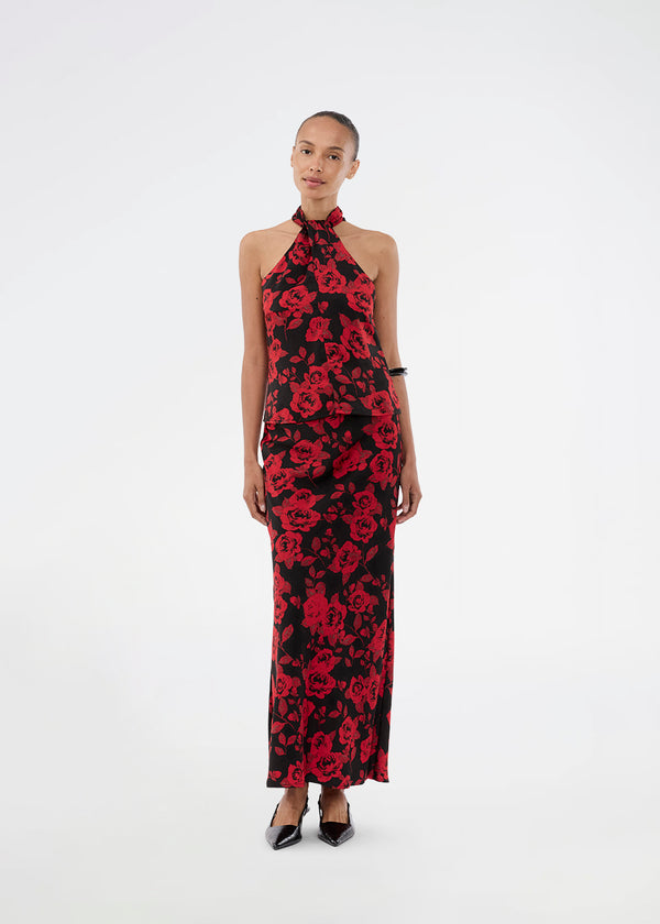 Halterneck top i et smukt rosenprint. Ruthiemd print top har en flot bar ryg og er lavet i genanvendt polyester - en klassisk og elegant styles.