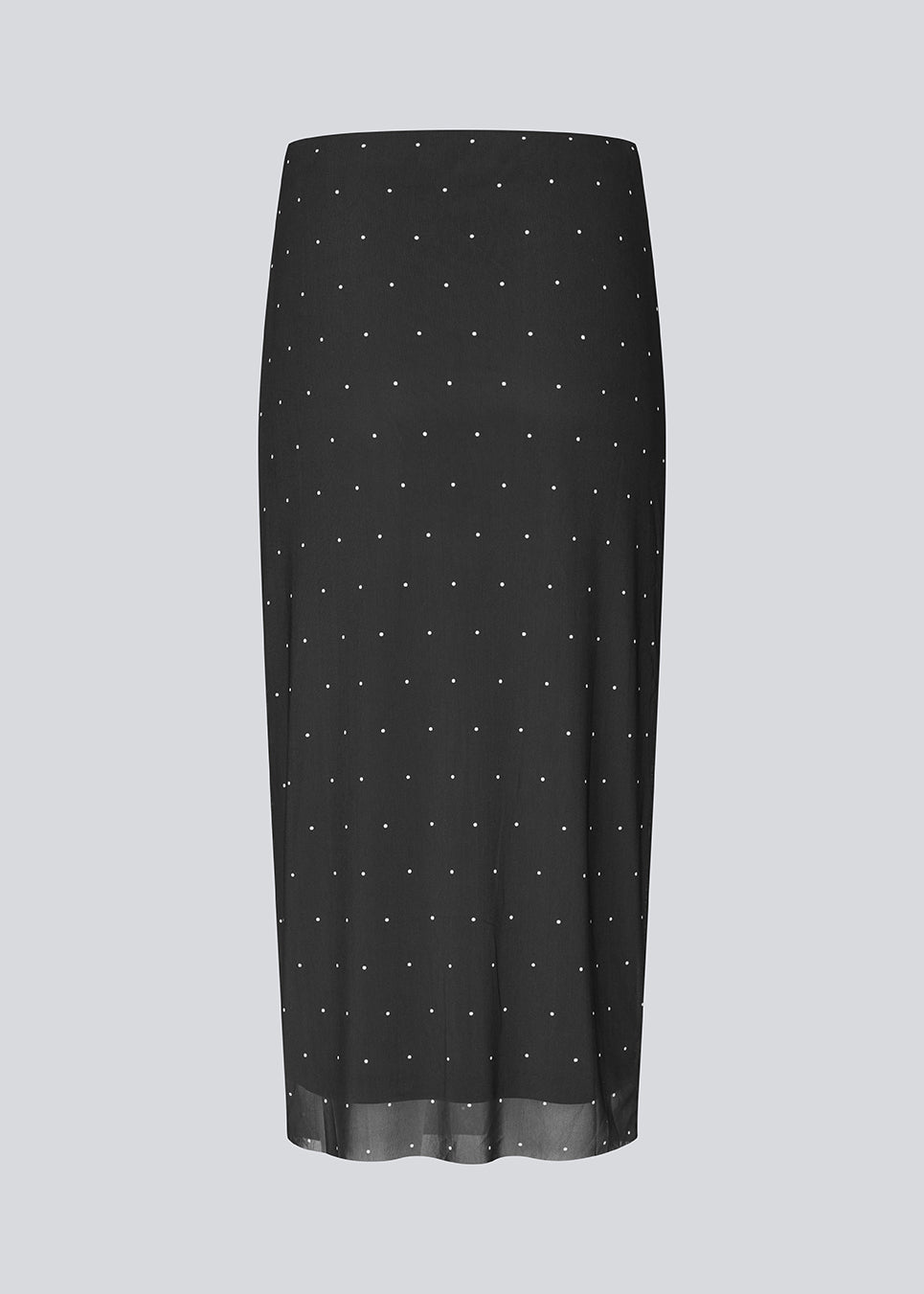 Figursyet sort midinederdel i mesh med hvide prikker og underskørt. Samalamd Print Skirt er lavet i 92% genanvendt polyester og kombinerer strækbarhed med komfort.