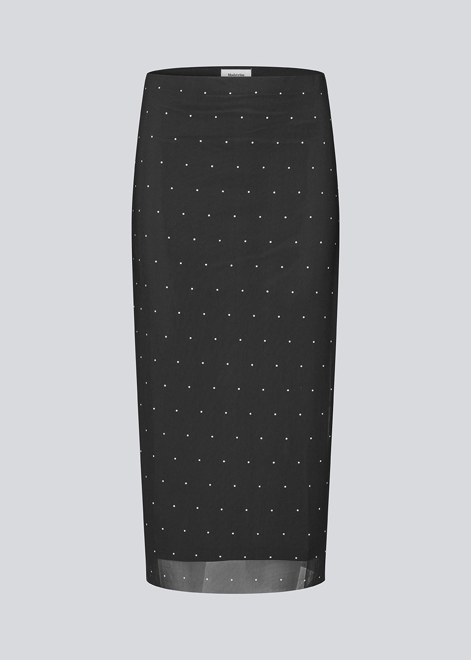 Figursyet sort midinederdel i mesh med hvide prikker og underskørt. Samalamd Print Skirt er lavet i 92% genanvendt polyester og kombinerer strækbarhed med komfort.
