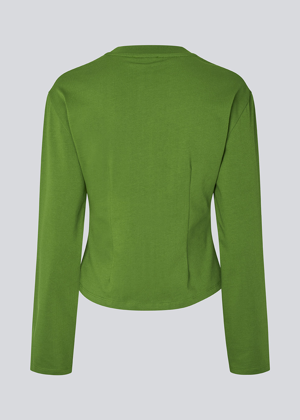 Let cropped t-shirt i blød 100% økologisk bomuld. TampaMD T-Shirt har rund hals, lange ærmer og figursyet pasform – en stilren og trendy basis-top, perfekt til lag-på-lag eller casual looks.