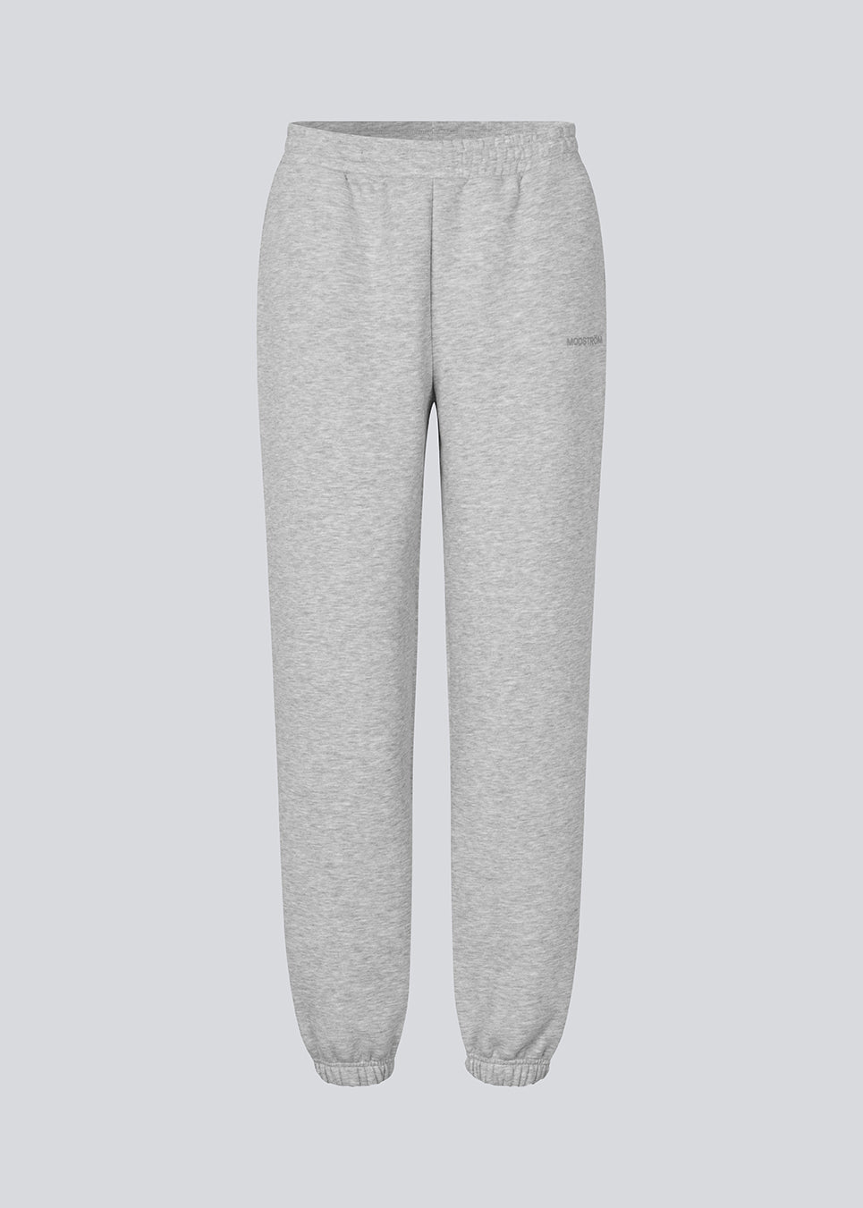 Sweatpants i grå i bomuldsblanding med logo. TiaMD pants har sidelommer, bindebånd og elastik i benene og taljen.