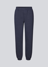 Sweatpants i mørkeblå i bomuldsblanding med logo. TiaMD pants har sidelommer, bindebånd og elastik i benene og taljen.