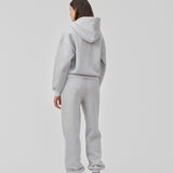 Sweatshirt i grå i bomuldsblanding med lynlås og logo. TiaMD zip har lommer, hætte med snørre og ribkant ved ærmer og bund.