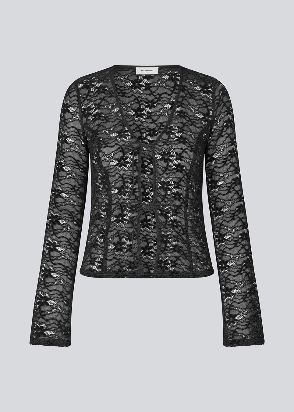 Figursyet top i stretchy blonde med ærmer, der bliver bredere forneden. TildeMD lace top har en dyb V-udskæring og to bindebånd foran.