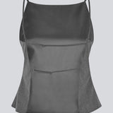 Ærmeløs top med tynde stropper. Tuesdaymd top har en åben ryg og justerbare stropper. Modellen er 175 cm og har en str s/36 på.

Style med matchende bukser: Tuesdaymd Pants.