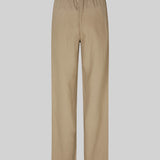 Lange bukser i farven Dune i et relaxed fit med lange brede ben, og elastik i taljen for ekstra komfort. TulsiMD pants er lavet i en blød blanding af hør og rayon. Modellen er 177 cm og har en størrelse S/36 på.