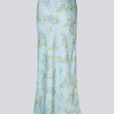 Elegant maxinederdel med et romantisk lyseblåt blomsterprint. Uttamd print skirt er fremstillet i 100% genanvendt polyester og har et flatterende snit, der falder smukt og giver et feminint udtryk. Modellen er 175 cm og har en str. S/36 på.

Materiale:
100% Recycled Polyester