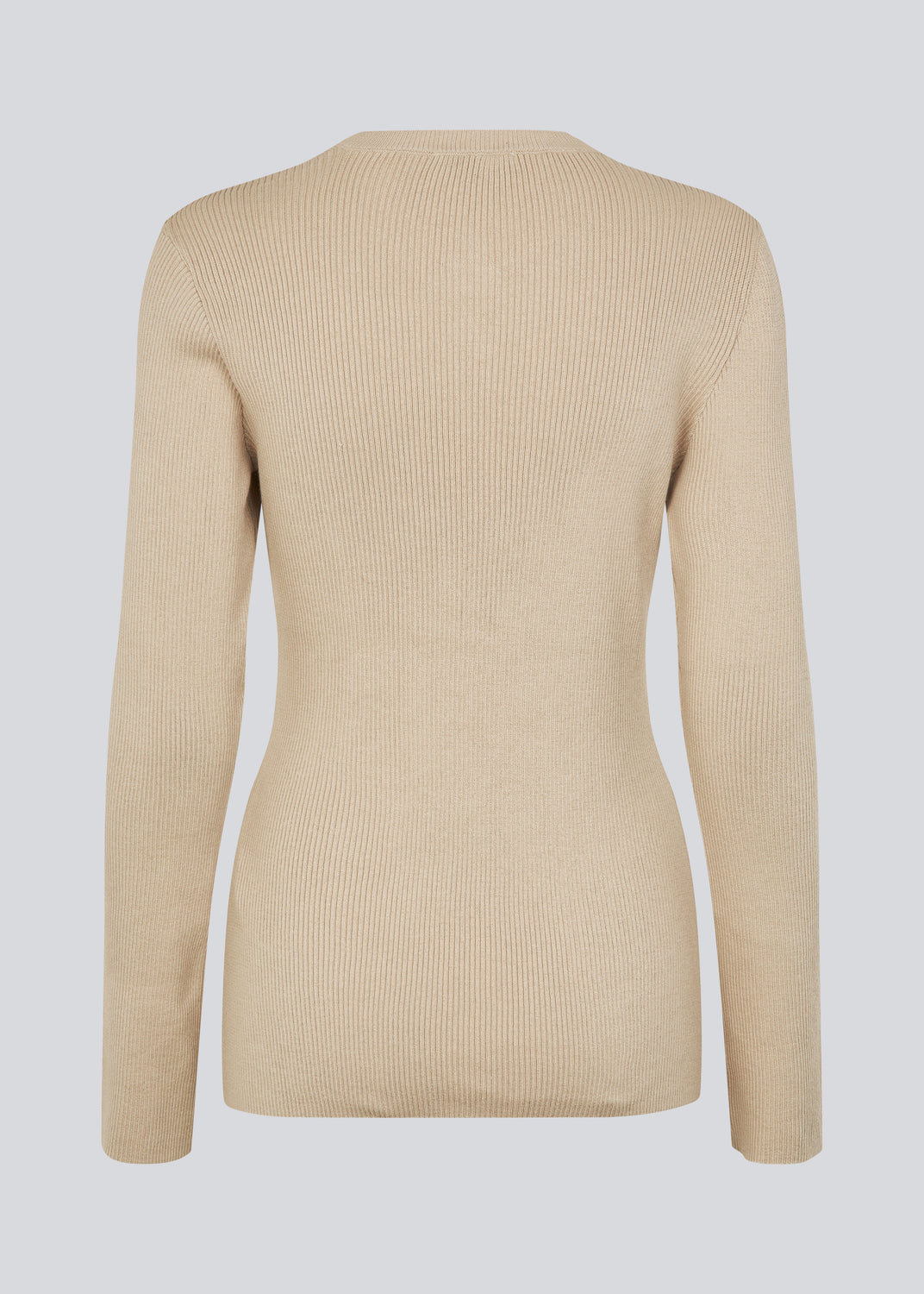 Tidsløs ribstrikket cardigan i beige med rund hals og knaplukning foran. Uvismd cardigan har en tætsiddende pasform og bløde kvalitet som giver et feminint og elegant udtryk. Perfekt til både hverdag og layering gennem sæsonerne.&nbsp;Modellen er 175 cm og har en str. S/36 på.


Materiale:
100% Økologisk Bomuld