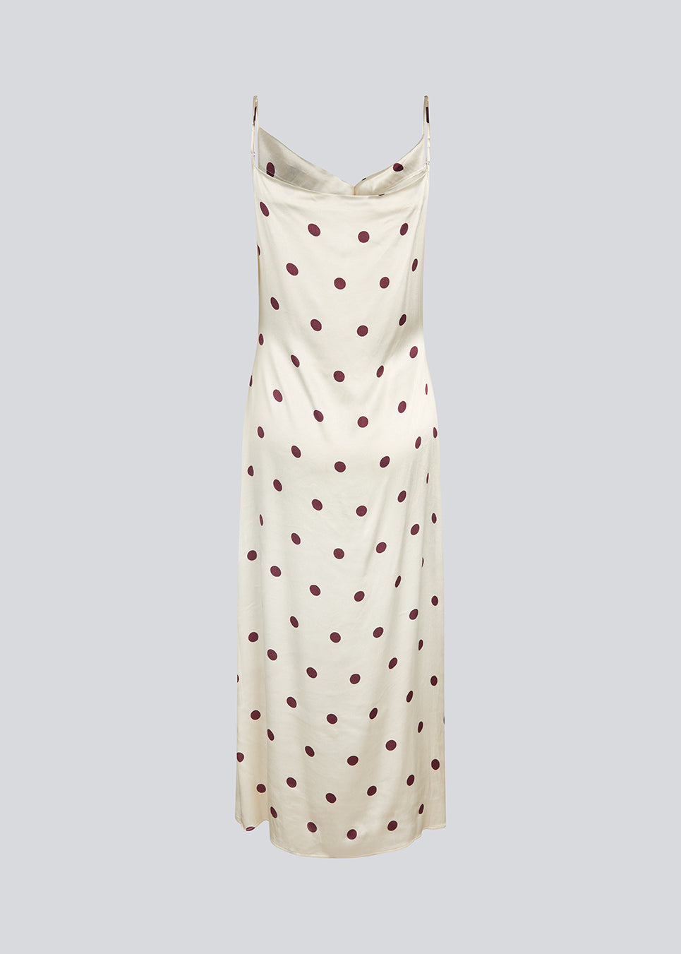 Lang kjole i satin med polkaprikker. Vanjamd Print Dress har fine spaghettistropper, vandfaldsudskæring og et løst, elegant fald, der skaber et feminint og moderne udtryk. 