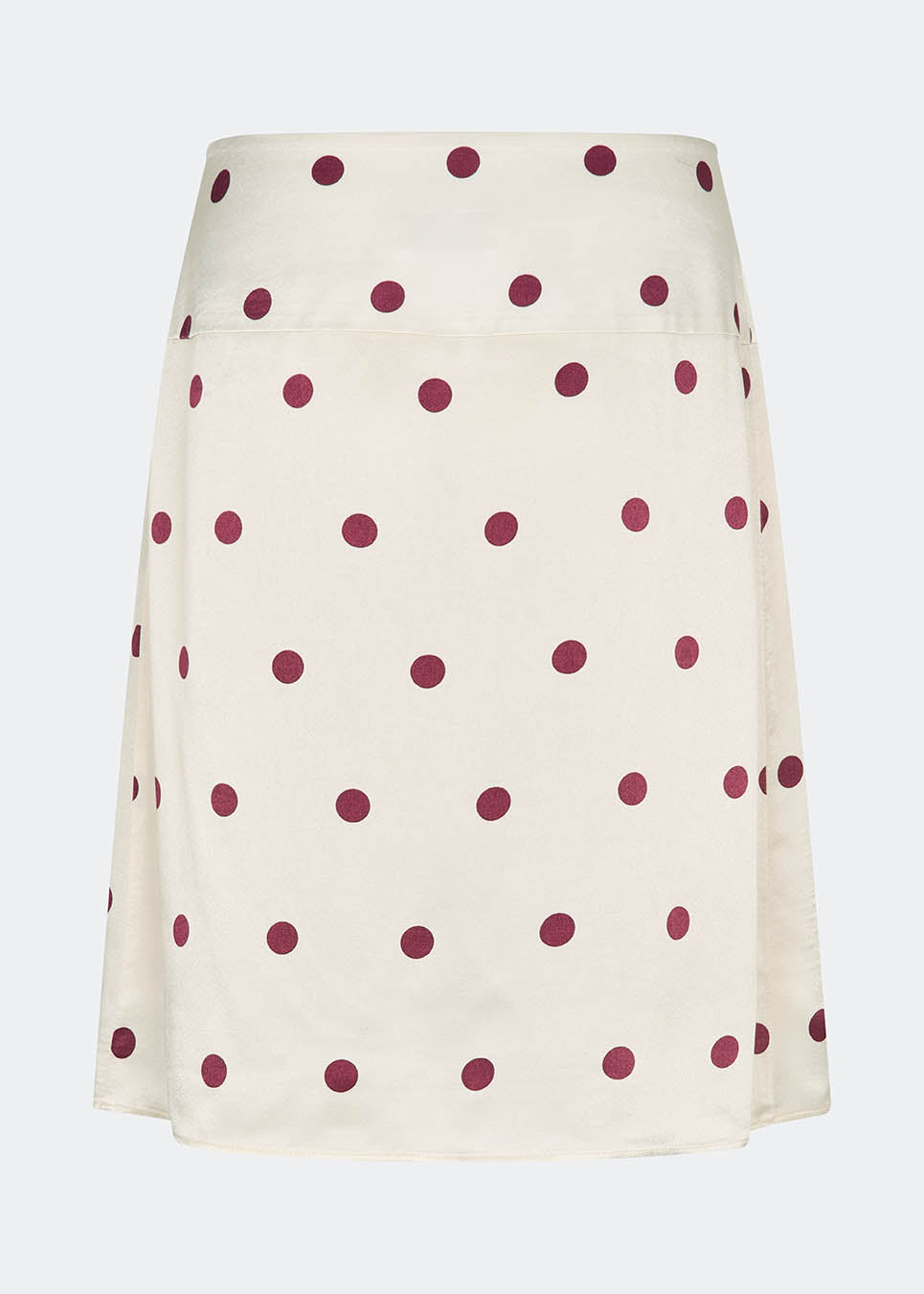 Feminin midi-nederdel med polkaprikker. VanjaMD print skirt fremhæver taljen, mens det løse fald skaber et elegant og afslappet look. Perfekt til både hverdag og fest.