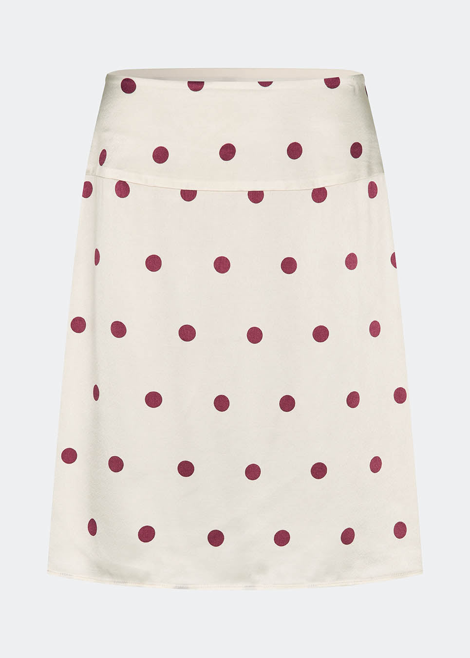 Feminin midi-nederdel med polkaprikker. VanjaMD print skirt fremhæver taljen, mens det løse fald skaber et elegant og afslappet look. Perfekt til både hverdag og fest.