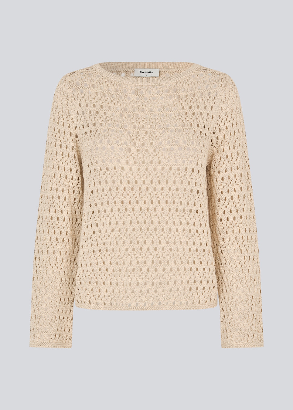 Strikket langærmet beige top med hulmønster, perfekt til lag-på-lag. VesterMD O-neck er fremstillet i 100% økologisk bomuld og har en klassisk rund hals.