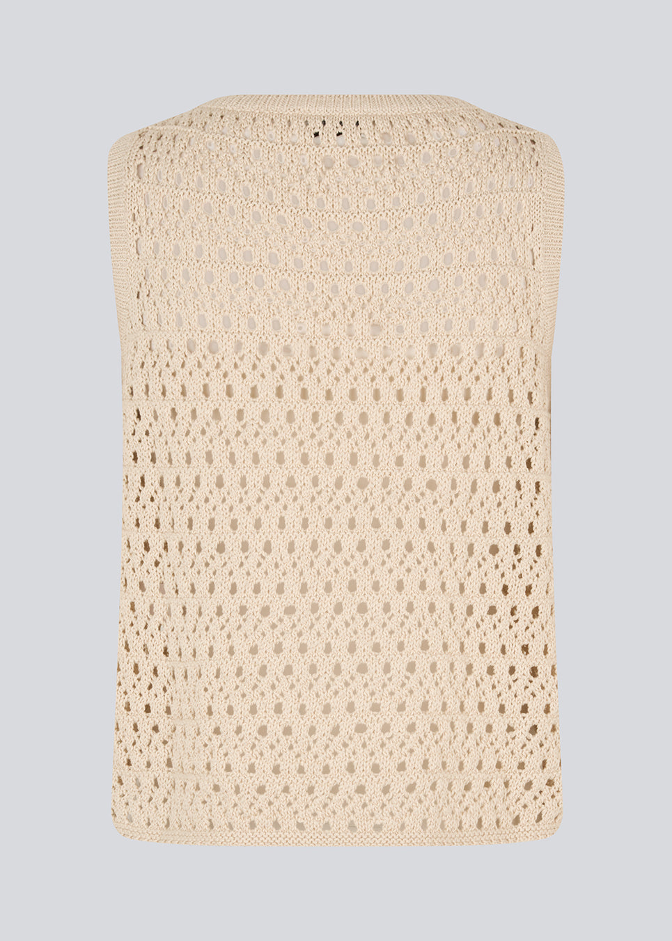 Strikket beige ærmeløs top med hulmønster, perfekt til lag-på-lag. VesterMD top er fremstillet i 100% økologisk bomuld og har en klassisk rund hals.