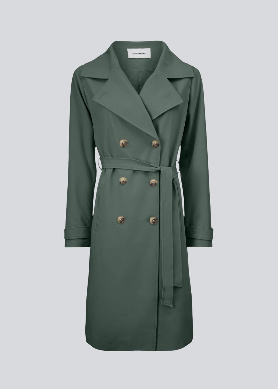 Trenchcoat jakke i smuk grøn med i et klassisk udtryk bred krave, bælte i livet og knaplukning. Hiro jacket er perfekt som overgangsjakke fra vinter til forår. Jakken har en rummelig pasform.&nbsp;