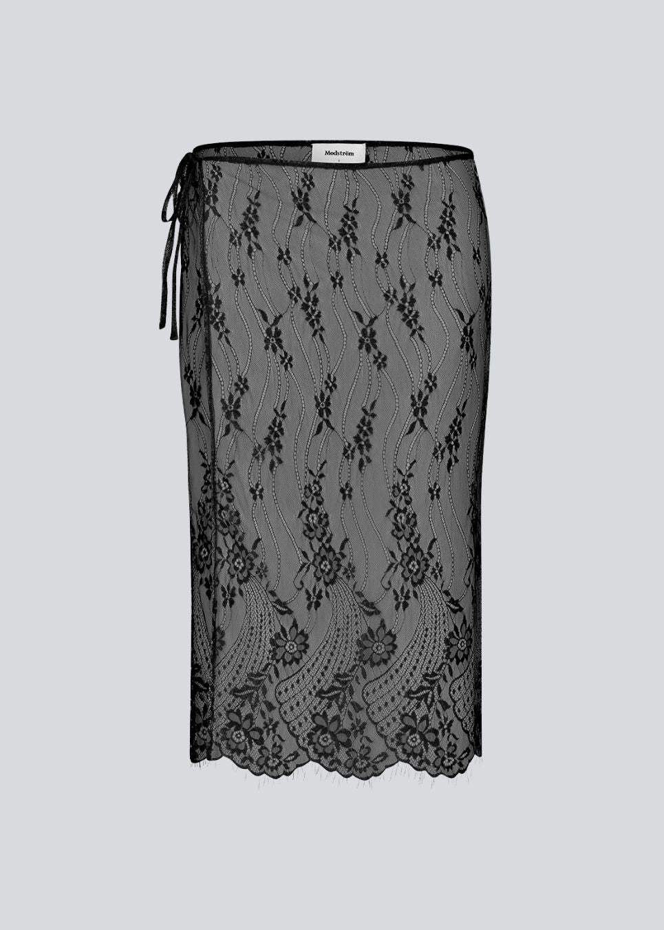 Et firkantet, gennemsigtigt blondetørklæde, der bruges som slå-om nederdel. Taffymd waist scarf bindes i siden og bæres over bukser som en del af lag-på-lag trenden.