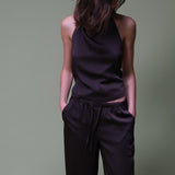 Brune løse satin bukser. Timmiemd pants har brede ben, lommer og en bindelunkning. Et afsalappet fit med et elegant udtryk.