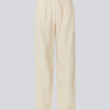 Lange bukser i beige i et relaxed fit med lange brede ben, og elastik i taljen for ekstra komfort. TulsiMD pants er lavet i en blød blanding af hør og rayon. 