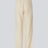 Lange bukser i beige i et relaxed fit med lange brede ben, og elastik i taljen for ekstra komfort. TulsiMD pants er lavet i en blød blanding af hør og rayon. 
