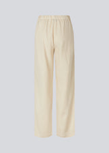 Lange bukser i beige i et relaxed fit med lange brede ben, og elastik i taljen for ekstra komfort. TulsiMD pants er lavet i en blød blanding af hør og rayon. 