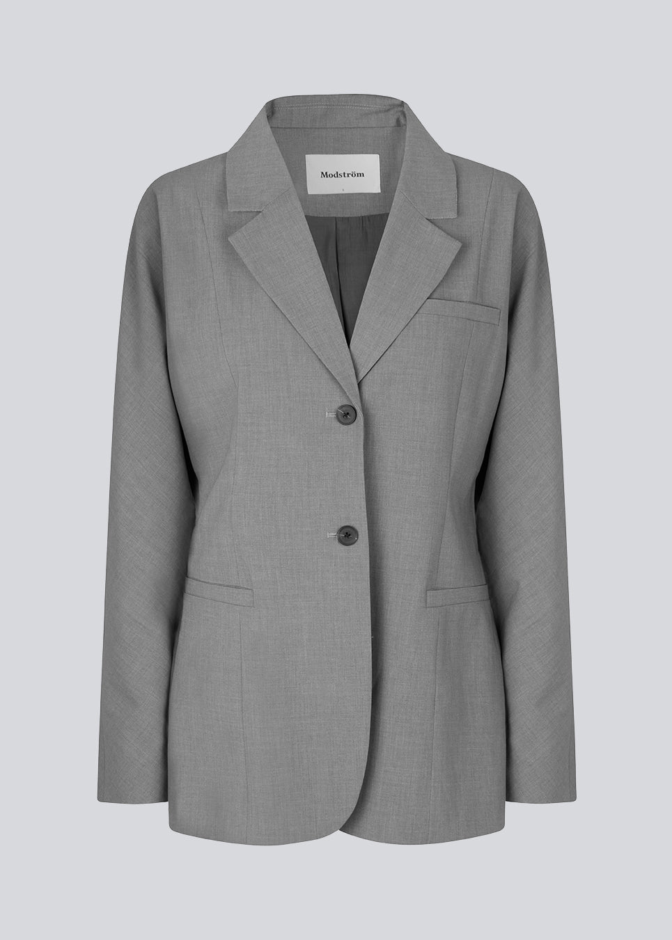 Figursyet blazer i grå med voluminøse ærmer og bløde lommer, samt krave og revers. Uden slids bagpå. Modellen er 176 cm og har en størrelse S/36 på.  Match blazeren med bukserne: BennyMD pants.