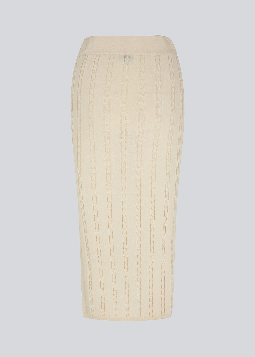 Kabelstrikket nederdel i midi-længde med slids foran. CarltonMD skirt har en tætsiddende pasform og mellem høj talje med beklædt elastik. Modellen er 177 cm og har en størrelse S/36 på.  Shop matchende top: CarltonMD top.