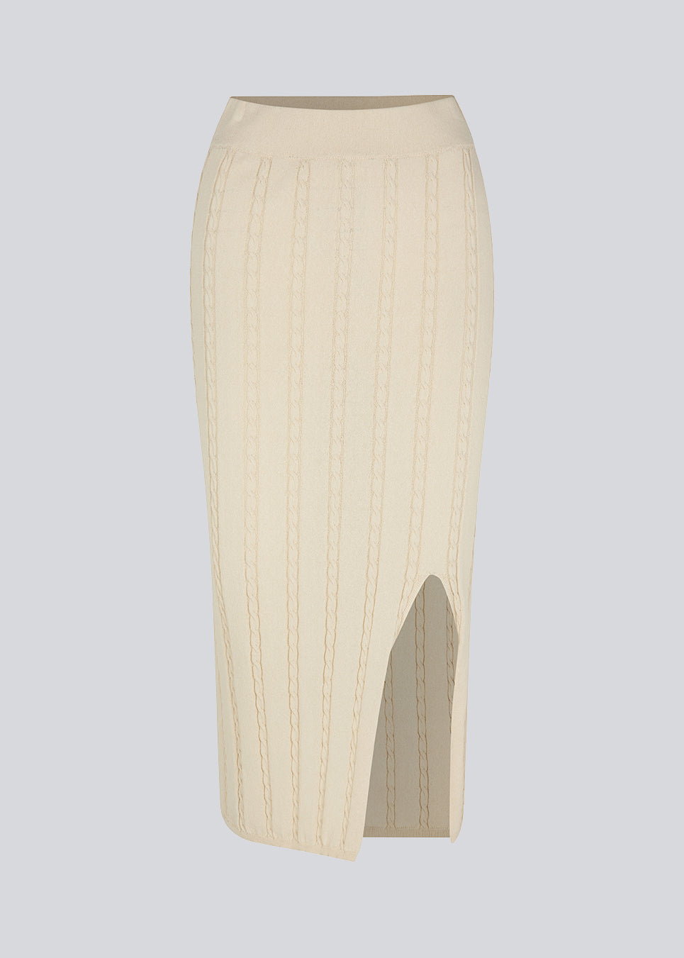 Kabelstrikket nederdel i midi-længde med slids foran. CarltonMD skirt har en tætsiddende pasform og mellem høj talje med beklædt elastik. Modellen er 177 cm og har en størrelse S/36 på.  Shop matchende top: CarltonMD top.
