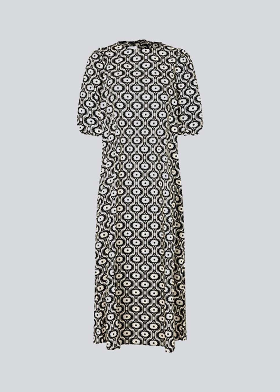 Lang kjole med vidde i skørtet og store pufærmer. CoraMD print dress har en rund hals med udskæring og sløjfe i ryggen. Fremstillet i økologisk bomuld. Modellen er 174 cm og har en størrelse S/36 på.