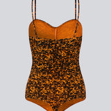 Bodystocking med tætsiddende pasform, hjerteformet udskæring med rynkedetalje og tynde justerbare stropper. CurtisMD print bodystocking har fint blomsterprint.