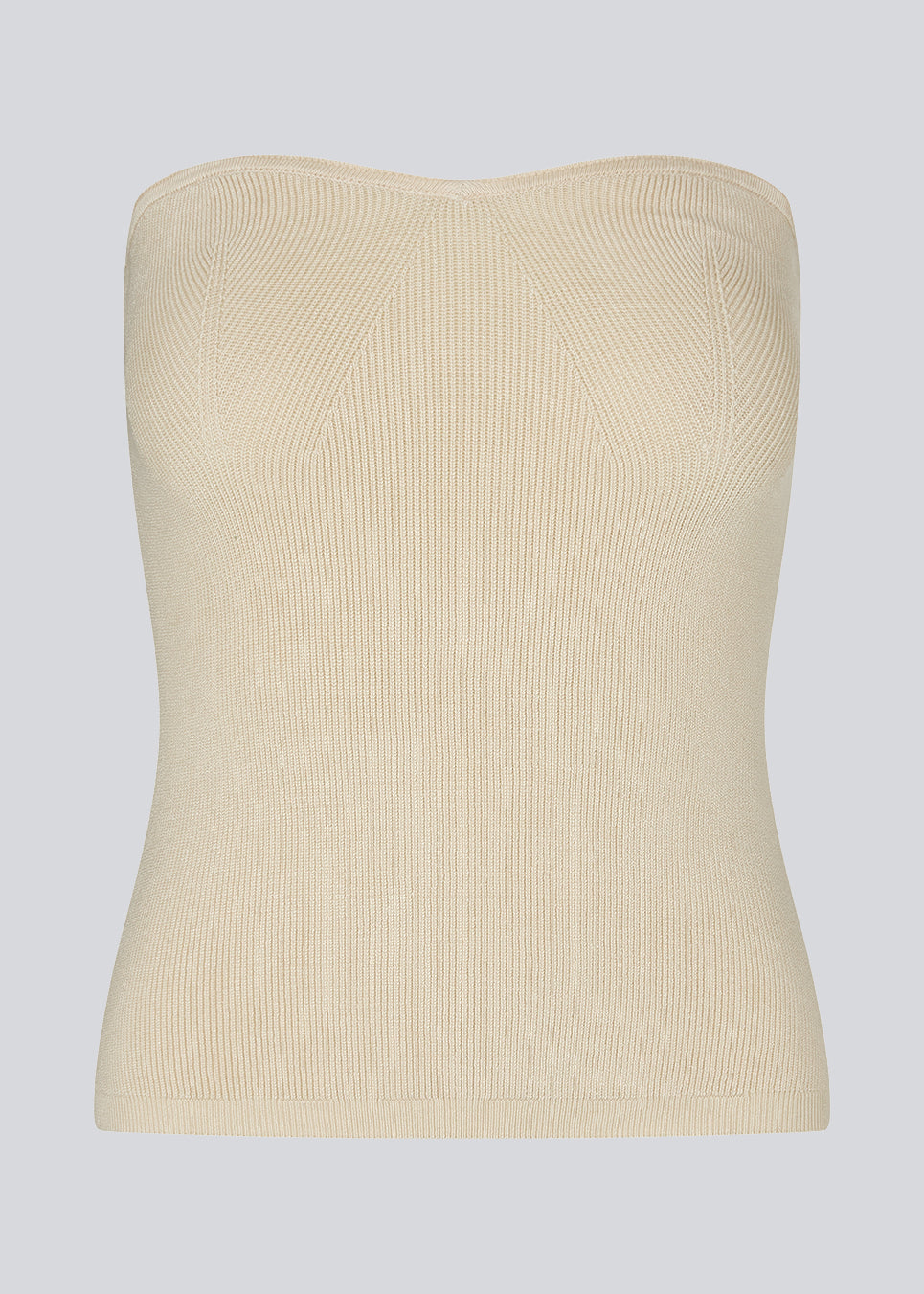 Råhvid tube top med tætsiddende pasformog hjerteudskæring foran. DiegoMD top er lavet i en blød ribstrik med silikonekant på indersiden af udskæringen. Modellen er 177 cm og har en størrelse S/36 på.