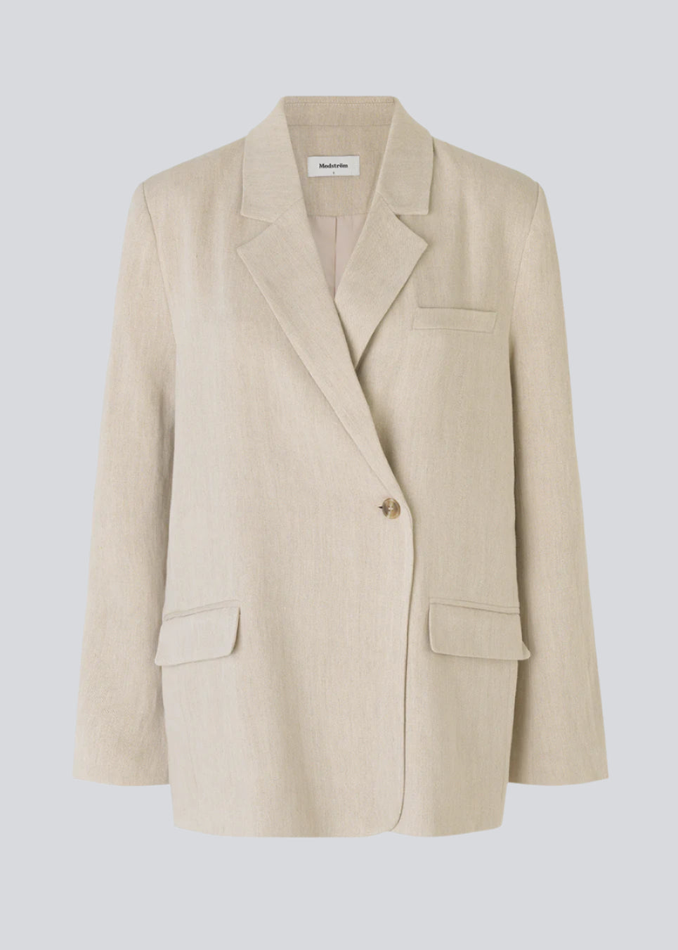 Blazer i et voluminøst fit med et asymmetrisk look. Park blazer er i en let hørkvalitet, som kan styles med de matchende bukser eller over en kjole på en sommeraften.