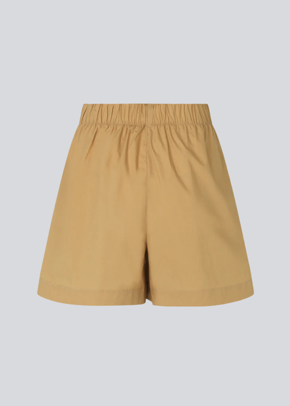 Shorts i let, økologisk bomuldspoplin. TapirMD shorts har høj talje med beklædt elastik og korte, vide ben. Lommer i sidesømmen samt kort slids i siderne.  Materiale: 100% Økologisk Bomuld